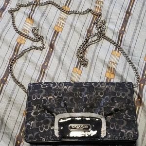 Black and silver Coach crossbody bag